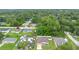 Overhead view showcasing the neighborhood with lush greenery surrounding well-maintained homes at 1725 12Th St, Orange City, FL 32763