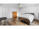 Neutral bedroom featuring hardwood floors, closet and a white comforter at 1725 12Th St, Orange City, FL 32763