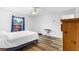 Bright bedroom with a white comforter, hardwood floors and natural light at 1725 12Th St, Orange City, FL 32763