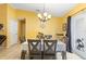 Bright dining room featuring a modern table setting, chandelier, and ample natural light, perfect for gatherings at 1725 12Th St, Orange City, FL 32763