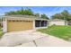 Charming single-story home featuring an attached garage and partially screened porch in a quiet neighborhood at 1725 12Th St, Orange City, FL 32763