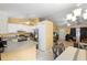Full view of kitchen into the living area showcasing the stainless steel appliances and open floor plan at 1725 12Th St, Orange City, FL 32763