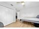 Clean bedroom with wood-look floors and a double closet, offering ample storage space at 1734 Magnolia Ave, Deland, FL 32724