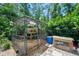 The backyard shows a custom chicken coop nestled among the trees, with space for chickens to roam at 1734 Magnolia Ave, Deland, FL 32724
