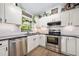 A view of the stylish kitchen offering stainless steel appliances and lots of natural light at 1734 Magnolia Ave, Deland, FL 32724
