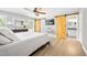 Bright main bedroom includes ensuite bathroom and barn door access at 1734 Magnolia Ave, Deland, FL 32724