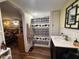 Bathroom with a vanity, shower with patterned curtain, and neutral decor at 17531 Ne 139Th Ave, Fort Mc Coy, FL 32134