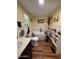 Bright bathroom with a standalone tub, decorative accents, and organized shelving at 17531 Ne 139Th Ave, Fort Mc Coy, FL 32134