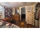 Well-lit bedroom with rustic furniture, bear themed curtains, and hardwood floors at 17531 Ne 139Th Ave, Fort Mc Coy, FL 32134