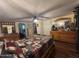 Bright bedroom with wooden accents, decorative bedding, and ample natural light at 17531 Ne 139Th Ave, Fort Mc Coy, FL 32134
