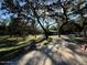 Picturesque wooded lot with outbuildings and a brick driveway at 17531 Ne 139Th Ave, Fort Mc Coy, FL 32134