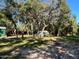 Expansive wooded lot with a storage building and trailer, providing a sense of privacy and space at 17531 Ne 139Th Ave, Fort Mc Coy, FL 32134