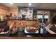 Bright kitchen features a coffee bar, wooden walls and cabinets, and a view to the outdoors at 17531 Ne 139Th Ave, Fort Mc Coy, FL 32134