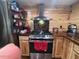 The kitchen features a stainless steel range hood, wooden cabinets, and a stainless steel refrigerator at 17531 Ne 139Th Ave, Fort Mc Coy, FL 32134