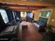 Relaxing living room featuring cozy seating and a mounted television at 17531 Ne 139Th Ave, Fort Mc Coy, FL 32134