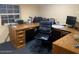 Well-lit office with a spacious wooden desk and an ergonomic chair at 17531 Ne 139Th Ave, Fort Mc Coy, FL 32134
