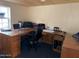 Functional office with large wooden desk and a comfortable rolling chair at 17531 Ne 139Th Ave, Fort Mc Coy, FL 32134