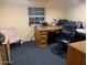 Practical home office setup featuring a wooden desk and a comfy chair at 17531 Ne 139Th Ave, Fort Mc Coy, FL 32134