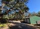 View of the property with large trees and parking for multiple vehicles at 17531 Ne 139Th Ave, Fort Mc Coy, FL 32134