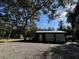View of the shed with 3 garage doors and room to park at 17531 Ne 139Th Ave, Fort Mc Coy, FL 32134