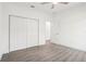 Neutral bedroom featuring light gray wood-look floors, white walls, and a closet at 1856 9Th Ave, Deland, FL 32724