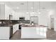 Modern kitchen features stainless steel appliances, a kitchen island, and stylish pendant lighting at 1856 9Th Ave, Deland, FL 32724