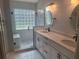 Modern bathroom featuring a walk-in shower, and dual sinks with vanity at 2051 Sherwood Forest Dr, Orange City, FL 32763