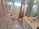 Bathroom with a tiled floor, white cabinets and a tub at 2051 Sherwood Forest Dr, Orange City, FL 32763