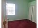 Red carpet bedroom with natural light, a window, and a closet at 2051 Sherwood Forest Dr, Orange City, FL 32763