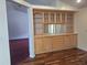 Dining room featuring hardwood floors and a built-in cabinet with storage at 2051 Sherwood Forest Dr, Orange City, FL 32763