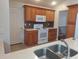 Updated kitchen featuring modern appliances, tiled floors, and ample cabinet space at 2051 Sherwood Forest Dr, Orange City, FL 32763