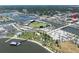 Panoramic aerial view showcasing the baseball field, marina, and surrounding green spaces within the neighborhood at 208 Wall St # 204, Daytona Beach, FL 32114