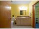 Spacious bathroom featuring sleek vanity, a walk in closet and tile flooring at 208 Wall St # 204, Daytona Beach, FL 32114