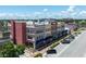 Corner view of a multi-story commercial building with varied architectural details and ample street parking at 208 Wall St # 204, Daytona Beach, FL 32114
