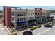 Stylish three-story mixed-use building with varied architectural details and ample street parking at 208 Wall St # 204, Daytona Beach, FL 32114