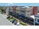 Street-level view of a colorful multi-story building with retail and office space with nearby parking at 208 Wall St # 204, Daytona Beach, FL 32114