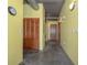 Hallway features polished floors and great lighting leading to living areas and bedrooms at 208 Wall St # 204, Daytona Beach, FL 32114