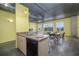 Open floorplan showcases the kitchen with stainless appliances and modern industrial finishes at 208 Wall St # 204, Daytona Beach, FL 32114