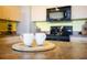 Close up on kitchen countertop with modern dark appliances, perfect for food preparation at 208 Wall St # 204, Daytona Beach, FL 32114
