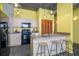 Well-equipped kitchen featuring bar seating, modern appliances, and light cabinetry at 208 Wall St # 204, Daytona Beach, FL 32114