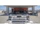 A furnished rooftop patio with a covered outdoor dining and seating area perfect for entertaining and relaxing at 208 Wall St # 204, Daytona Beach, FL 32114