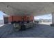 A covered rooftop patio featuring a barbecue grill, wet bar, and ample seating for outdoor enjoyment at 208 Wall St # 204, Daytona Beach, FL 32114