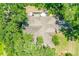 Overhead shot of home with a neutral roof, green lawn, and mature landscaping at 2163 Fireside Rd, Deltona, FL 32738