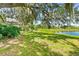 A view of the pond from the lawn showing the house in the background at 2163 Fireside Rd, Deltona, FL 32738