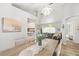 Open concept dining room flowing into the living room and kitchen, creating a perfect space for entertaining at 2163 Fireside Rd, Deltona, FL 32738