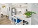 Bright kitchen featuring a breakfast bar with seating and stainless steel refrigerator at 2163 Fireside Rd, Deltona, FL 32738