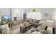 Inviting living room with plush seating, wood floors, and decorative touches offering comfort and style at 2163 Fireside Rd, Deltona, FL 32738