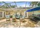 Outdoor patio with lots of seating, including a large round table with barstool seating at 2163 Fireside Rd, Deltona, FL 32738