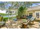 Lakeside screened patio with comfortable seating and a view of the water at 2163 Fireside Rd, Deltona, FL 32738