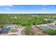 Aerial shot showcases a home in a lush, green area with nearby houses and mature trees at 2478 Unionville Dr, Deltona, FL 32725